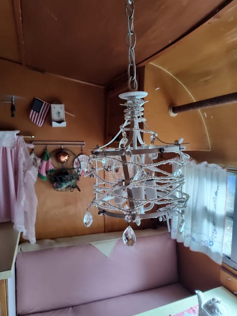 This little chandelier provides ambiance and  light  for your special dining experience while camping.