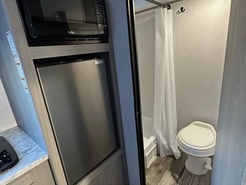 Bathroom, fridge and microwave 