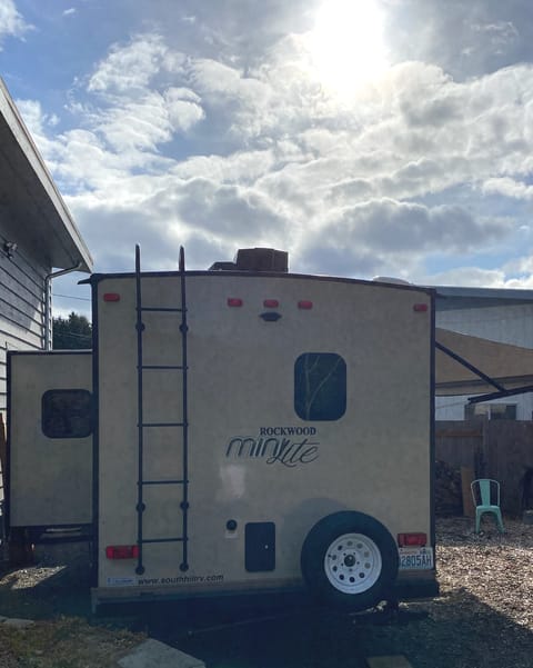 Slide out, outdoor shower on back of rig, new spare tire
