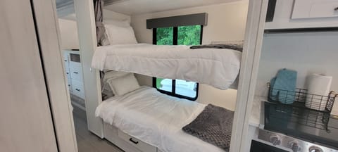 Extra long bunk beds with fresh linens, individual use USB plug in and windows for the amazing views you will see.  