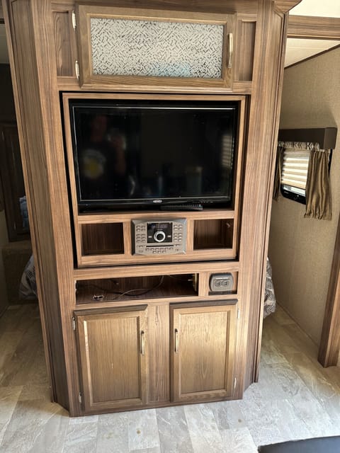 Large entertainment system with storage underneath.  