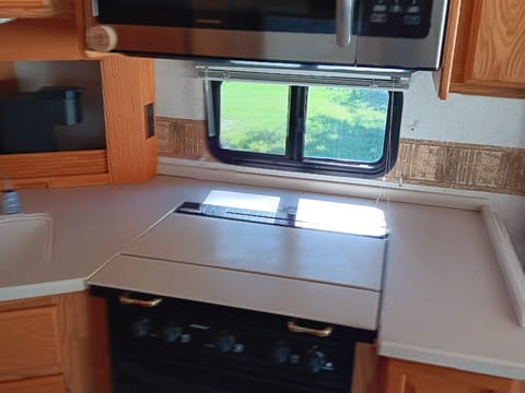 Brand new convection/microwave oven combo, three burner stove, and oven.
