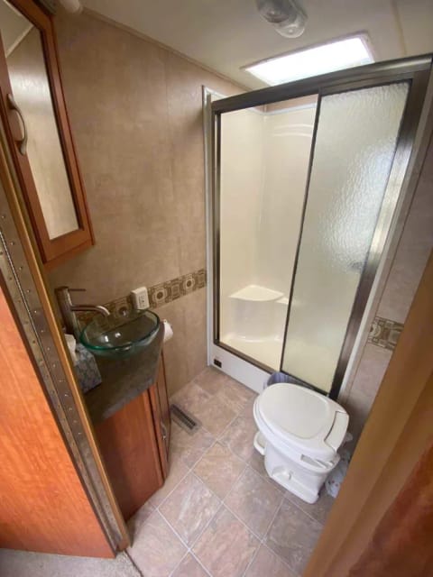 Bathroom is a decent size with a convenient seat in the shower. I was surprised by how good the water pressure is. 