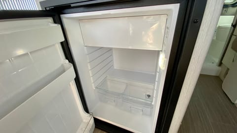 Freezer and refrigerator work well!  

There are two adjustable racks in the refrigerator but I was cleaning it so they aren't in the picture.
