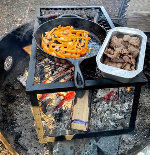 Grill is perfect for cooking over the campfire! (Cast iron skillet not included.)