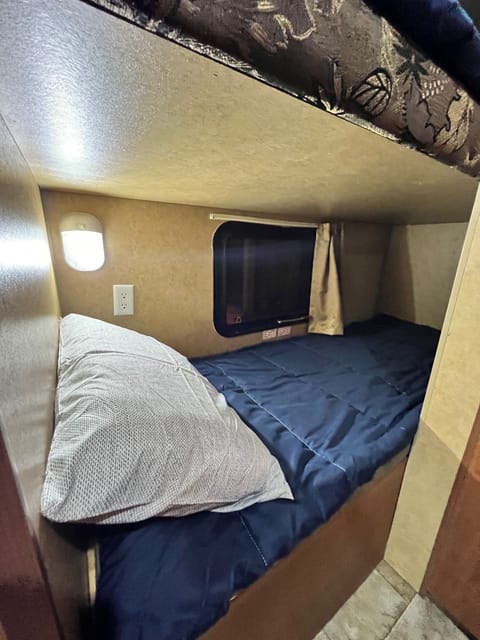 Lower bunk for the kids with a privacy window 