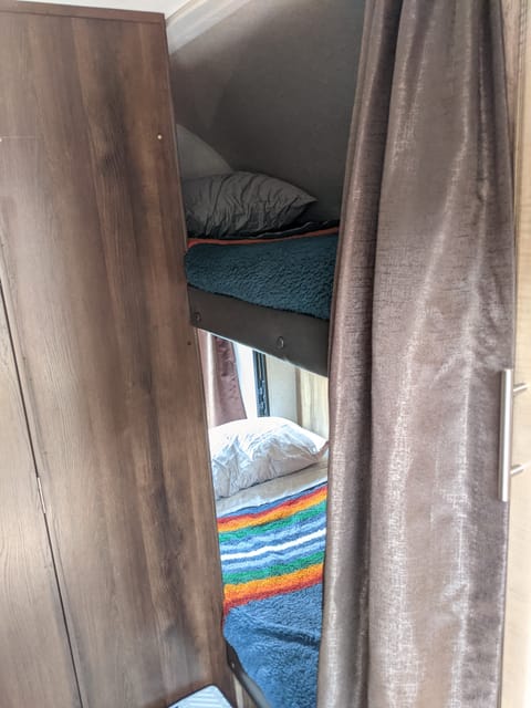 Bottom and top bunk (top bunk does not have a window). 