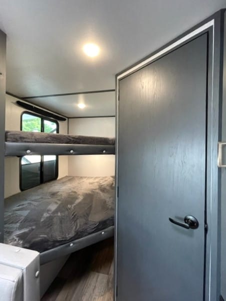 The convenience of the bunk house, a cleverly designed sleeping area that optimizes space and provides a comfortable resting spot for kids or extra guests. 