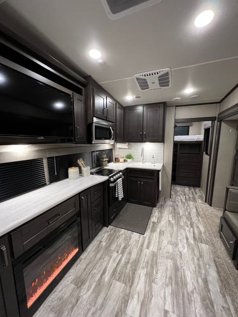 Nice open kitchen with plenty of countertops!