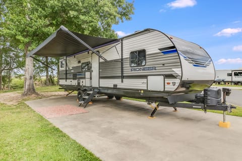 Enjoy your time outside at every campground with the outdoor lighted area under the awning. Bring your chairs to make the perfect seating area.