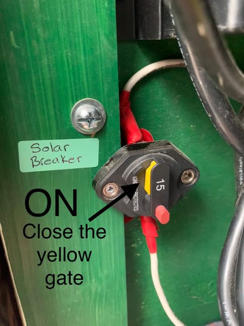 Solar Breaker: ON position;   Click the yellow gate closed to turn on Solar charging when engine is off. 