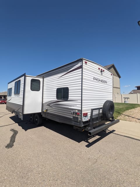 Water hook, tank dump and outside wash area in back of camper