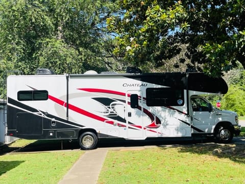 Passenger side and main entrance.  This side includes a 16 ft power retractable awning with LED lighting. Plenty of storage underneath. 