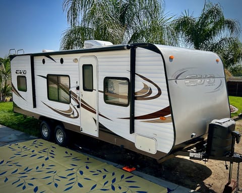 Light, easy-to-maneuver - Storage underneath - Electric awning - 2-tank propane capacity - Lots of windows for breezes!
