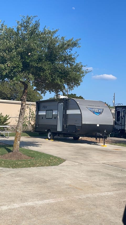 Trailer all set up in nice RV resort , gate community, swimming pool, lake (fishing and release) , exercise room, game room, outdoor grill.