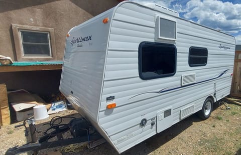 Battery and propane sit to the front of the trailer.  This side has access to electric plug in, water and propane pilot light.