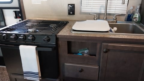 3 burner gas stove, oven, microwave, and double sink make this a great place to cook anything.