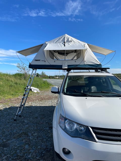 Olly the Outlander + Theo the Thule Tepui Rooftop Popup Tent camper in Dartmouth