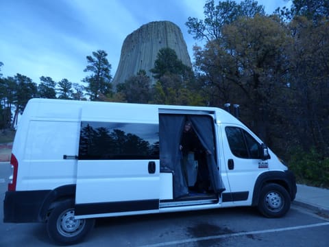 Enjoying a very close encounter with Devil's Tower National Monument, Wyoming. Notice again how easily we fit into a standard parking space.
