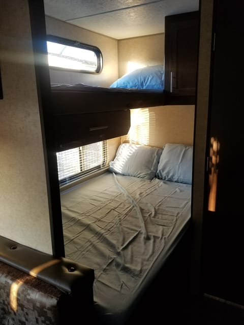 The bunks in the back. Double on bottom and single on top