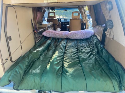 View from open tailgate. Bed setup for two.  