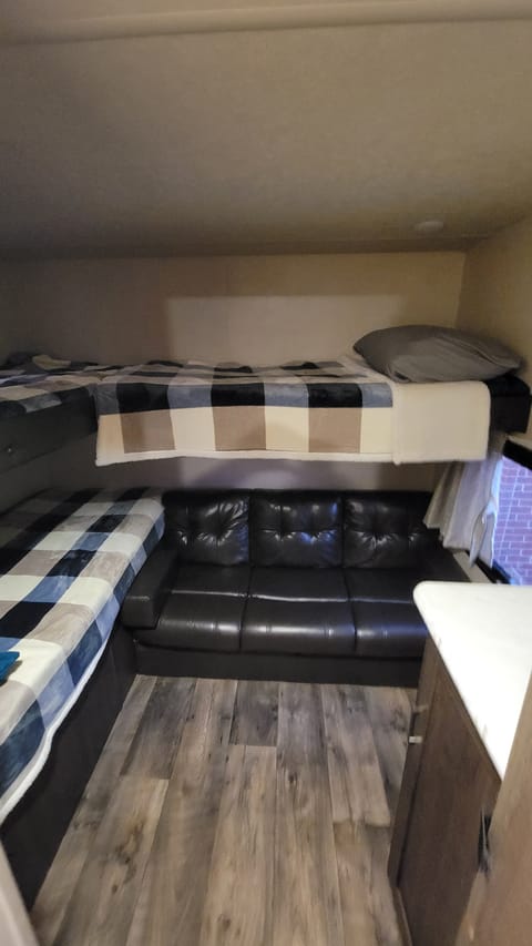 Bunk beds x 3, linens, pillows and bedding provided. Couch lays flat into another sleeping area. 