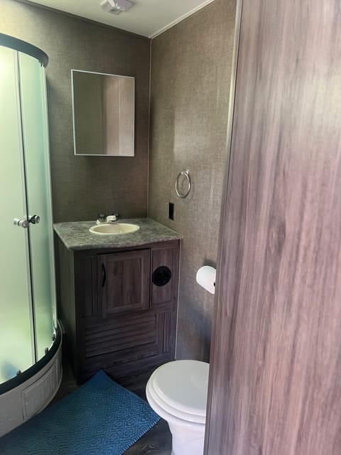 This is the bathroom with a shower. One of the largest bathrooms I’ve seen in a trailer.