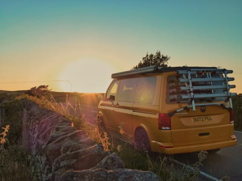 Bea, the yellow campervan, admiring a sunrise