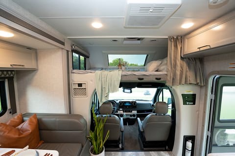 Driving area and bunk above seats. Comes with a step ladder to get up on the bunk and star gazing window which can open and close.
