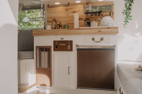 Kitchen of the Boler with fridge to the right and furnace to the left