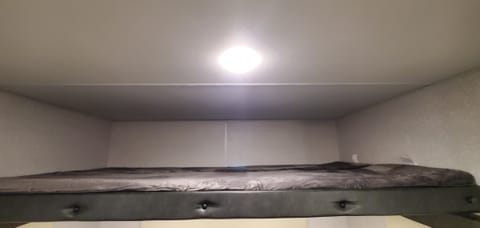 Overhead full size bunk bed.