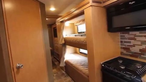 Bunk Beds with individual TV's in each bunk with built in DVD's in each TV and Remotes and a curtain to close off each bunk bed.