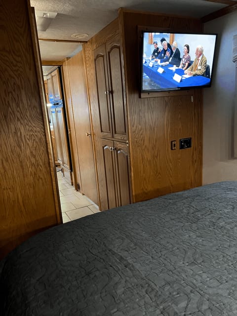 Primary sleeping area with tv.