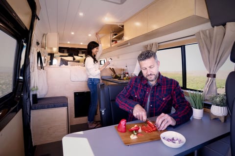 The spacious kitchen/lounge area lets everyone pitch in at mealtime! 