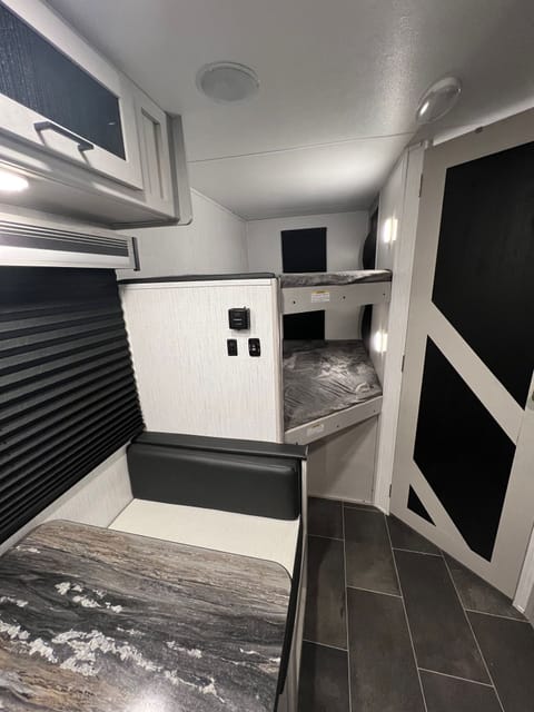 Spacious bunkbeds with individual lights and windows