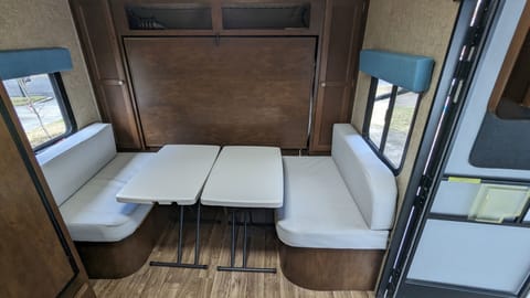 Newly-reupholstered dinette with added bench at back for kids. Adjustable height indoor/outdoor tables have more flexibility than the original table.