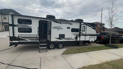 This extra long 19 ft. awing with under-lighting is waiting to cover you, your outdoor living space, and outdoor kitchen rain or shine. Kick back and listen to your favorite tunes on the two outdoor speakers. Also available is a power outlet to plug in anything your heart desires.  Also provided are two zero gravity reclining outdoor chairs.  