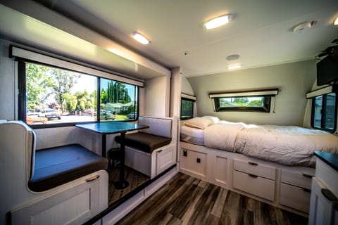 Dinette can be turned into a full size bed along with the queen size main bed in front 