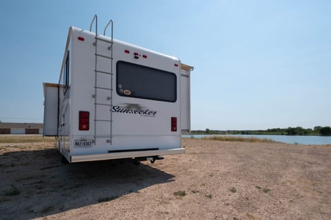 Back of the RV. Ladder to get to the roof, and hitch to pull anything you desire.