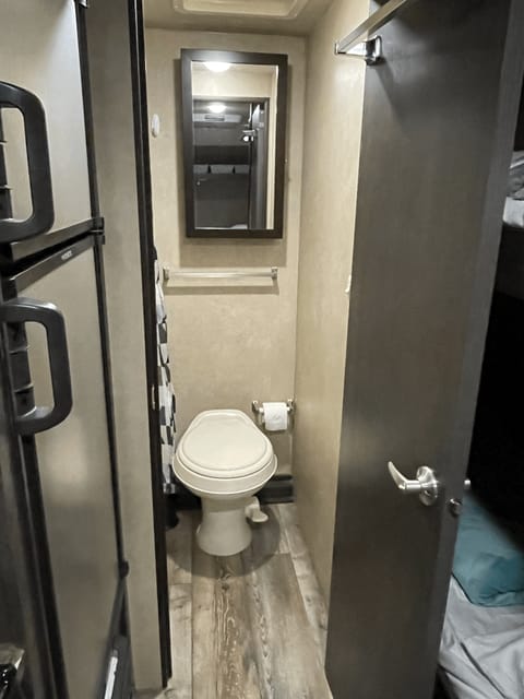 Toilet and medicine cabinet