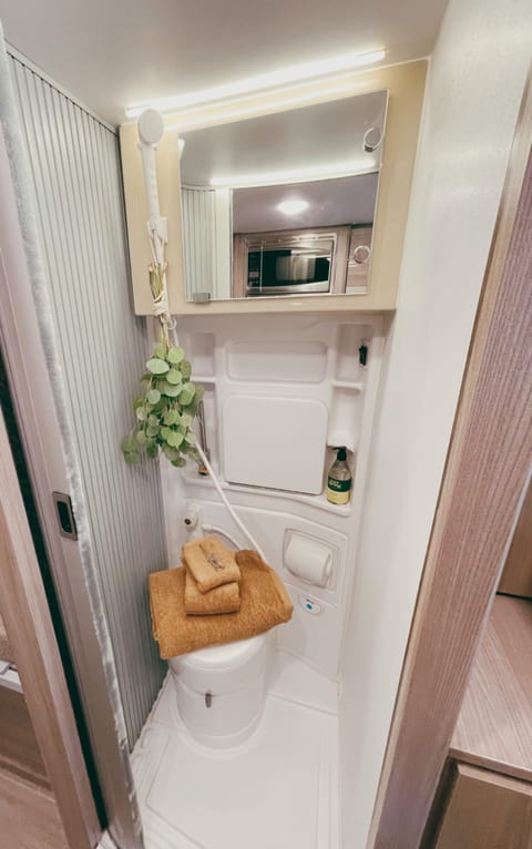 The bathroom on board includes a toilet and an indoor shower.