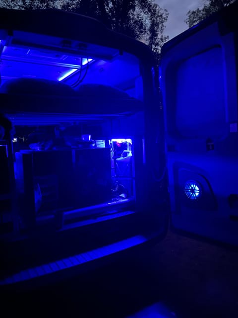Plenty of storage on the gear slide if bottom bed isn't set up.  Tiered accent lighting or bright white lights can be used as needed.