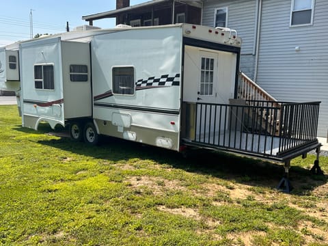 RV with deck and railing. 2 slide outs.  