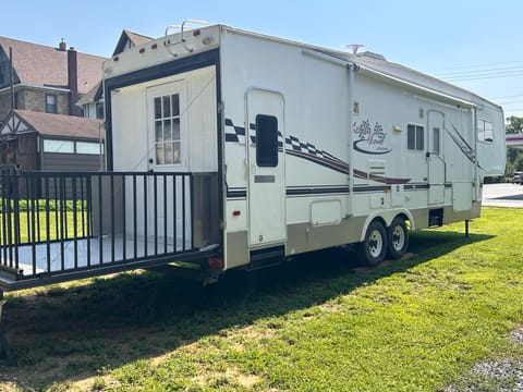 RV with deck and railing