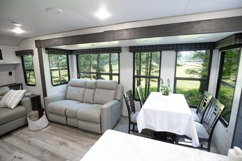 The living room/dining room area have large windows which give guests an amazing view of the forest.