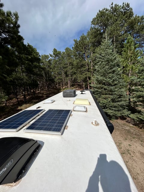 Two solar panels for powering two 12Volt batteries. These are useful when you are boondocking. DO NOT CLIMB ON THE ROOF!