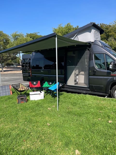 Power awning for comfortable seating outdoor. (4 camping chairs and Jackery Explorer 1500 portable station are included. )