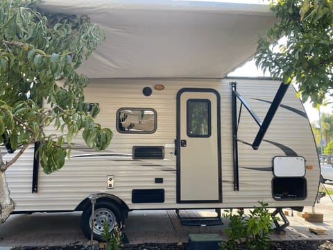 Full awning for shade, lightweight camper for traveling.