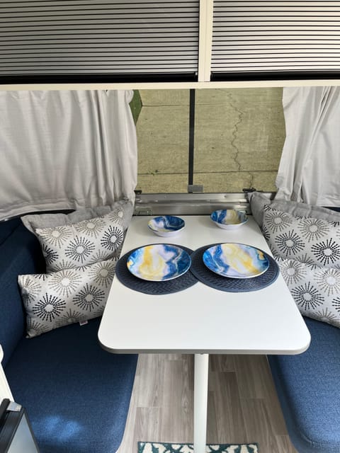 Plates and bowls packed in the cabinet above the sink 