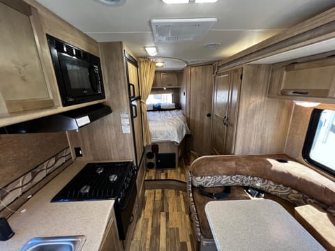 This is the cabin while driving. The additional 4 passenger seatbelts are in the dinette. Let the kids watch a show on the tv while you drive!